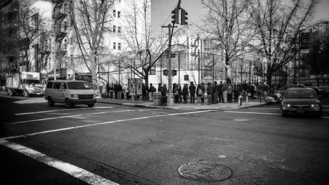 A long line of prospective Cronut buyers approaches Dominique Ansel's Bakery.